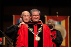 Austin Peay State University Board Chair Billy Atkins places the Presidential Medallion around Mike Licari’s neck. (APSU)