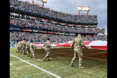 Soldiers from Blanchfield Army Community Hospital, Soldier Recovery Unit, Fort Campbell Dental Activity, Fort Campbell Veterinary Center and 531st Hospital Center unfurl a U.S. flag during Tennessee Titans and New Orleans Saints pregame ceremonies at Nissan Stadium, Nashville, Tennessee, Nov. 14. Leaders from the 101st Airborne Division (Air Assault) extended the opportunity to medical units at Fort Campbell to represent the division during the Tennessee Titans Salute to Service event honoring veterans. (U.S. Army photo by Maria Yager)