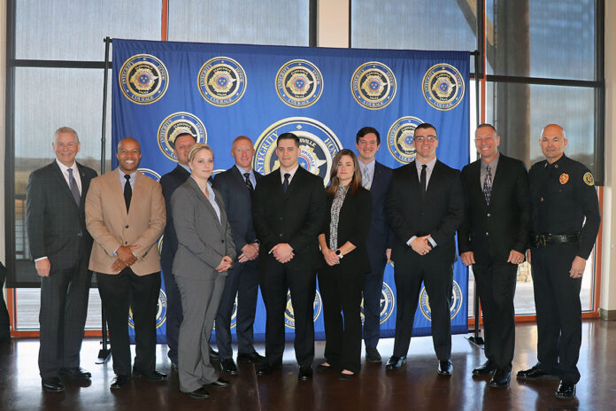 (L-R) Clarksville Mayor Joe Pitts, Bobby Scales, Cameron Owens, Stephanie Rattray, Jeremy McGuire, Cody Hall, Lindsey Fowler, Timothy Burlingame, Nicklaus Broadhurst, William Allen and Chief David Crockarell.