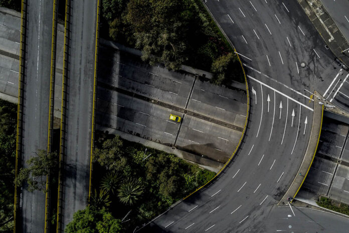 Worldwide restrictions during the COVID-19 Coronavirus pandemic caused huge reductions in travel and other economic activities, resulting in lower emissions. Seen here, almost-empty highways in Colombia during the pandemic. (International Monetary Fund)