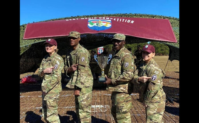 Regional Health Command-Atlantic Command Team, Brig. Gen. Mary Krueger and Command Sgt. Maj. Rebecca Booker join BACH Soldiers Staff Sgt. Jephte Guillaume and Staff Sgt. Terrence Laisin in showing their “Pride In The Patch“. Guillaume and Laisin won the Regional Health Command Atlantic Best Medic Competition after the team outscored 10 other teams from the region. RHC-A Best Medic is a four-day competition set at a grueling pace where competitors are tested on their physical, mental and technical proficiency. (BACH)