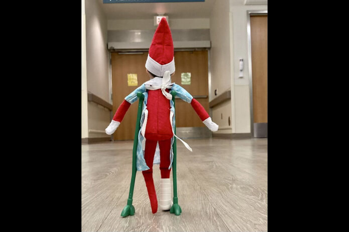 An elf gets accustomed to its crutches before being released from the Blanchfield Army Community Hospital Emergency Center. The elf was admitted to BACH after sustaining injuries during a sleigh accident. (Blanchfield Army Community Hospital)