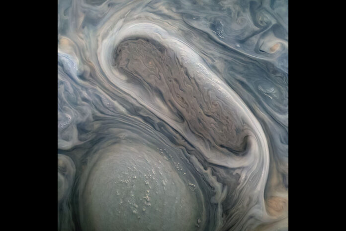 This JunoCam image shows two of Jupiter's large rotating storms, captured on Juno’s 38th perijove pass, on November 29th, 2021. (NASA/JPL-Caltech/SwRI/MSSS Image processing: Kevin M. Gill CC BY)