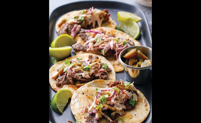 Heart-healthy* Mazola® helps make delicious Steak Tacos.