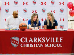 Caroline Watts (Center) signs her letter of intent with Clarksville Christian School Coach Trenton Hassell and Welch College Coach Katie Bryan.