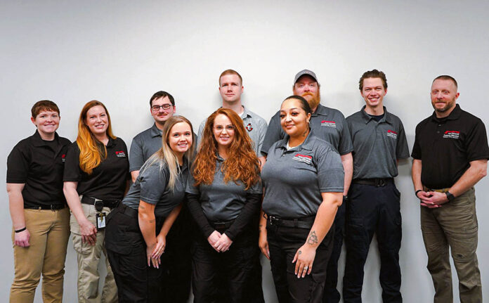 Full group photo front row (L to R) Whitney Sensing, Samantha Gearing and Elysia Rivera. Second row (L to R) Daniel Chester (Instructor), January Bukowitz (Instructor), Xander Gerakis, Justin Long, Robert Hutchinson, Grant Menard and Brian McNeeley (Instructor)