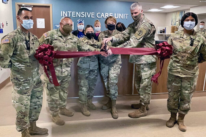 Regional Health Command-Atlantic Command Team, Brig. Gen. Mary V. Krueger and Command Sgt. Maj. Rebecca Booker, and Blanchfield Army Community Hospital Command Team Col. Vincent B. Myers and Command Sgt. Maj. Daniel Santiago, conducted a ceremonial ribbon cutting with Intensive Care Unit staff marking the official grand opening of the hospital’s ICU. The newly renovated 9,300-square foot ICU features eight new private ICU suites, a centralized nursing station, charting stations, all new ICU equipment and state-of-the-art telehealth capabilities through the Joint Tele-Critical Care Network, to better enable safe, quality care for Military Health System beneficiaries. (Maria Christina Yager, Blanchfield Army Community Hospital)