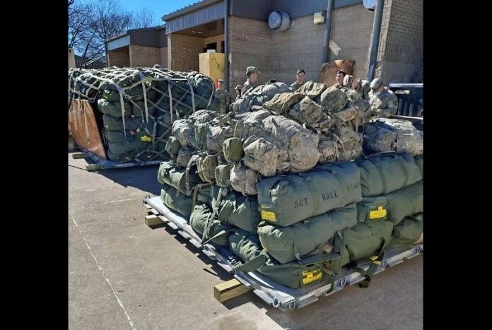 Soldiers with the 1st Squadron, 33rd Cavalry Regiment, 3rd Brigade Combat Team, palletize bags during an alert recall for an Emergency Readiness Deployment Exercise February 8th, 2022. (Staff Sgt. Michael Eaddy, 3rd Brigade Combat Team, 101st Airborne Division (AA) Public Affairs)