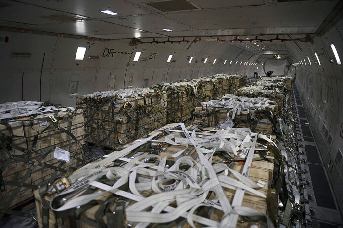 Pallets of ammunition, weapons and other equipment bound for Ukraine are loaded in the hold of a cargo plane at Dover Air Force Base, Del., Feb. 28, 2022. (Air Force Tech. Sgt. J.D. Strong II)