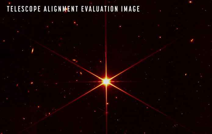 While the purpose of this image was to focus on the bright star at the center for alignment evaluation, Webb's optics and NIRCam are so sensitive that the galaxies and stars seen in the background show up. At this stage of Webb’s mirror alignment, known as “fine phasing,” each of the primary mirror segments have been adjusted to produce one unified image of the same star using only the NIRCam instrument. This image of the star, which is called 2MASS J17554042+6551277, uses a red filter to optimize visual contrast. (NASA/STScI)