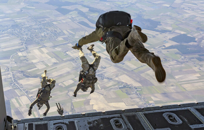 Polish special forces operators execute a military free fall jump from a U.S. Air Force MC-130J Commando II assigned to the 352d Special Operations Wing over Poland, March 11, 2022. (Air Force Staff Sgt. Izabella Workman)
