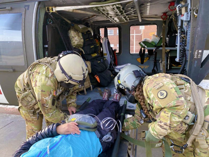 A Tennessee National Guard medical crew arrives at UT Medical Center with a hiker who suffered a severe illness on the Appalachian Trail, Mar. 15. The Tennessee National Guard conducted the emergency air evacuation mission after being notified of a severely ill hiker in the Great Smoky Mountains National Park. (Tennessee National Guard)