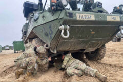 U.S. Army soldiers assigned to 3rd Squadron, 2nd Cavalry Regiment, inspect an M1131 Fire Support Vehicle in Adazi, Latvia, March 8th, 2022.