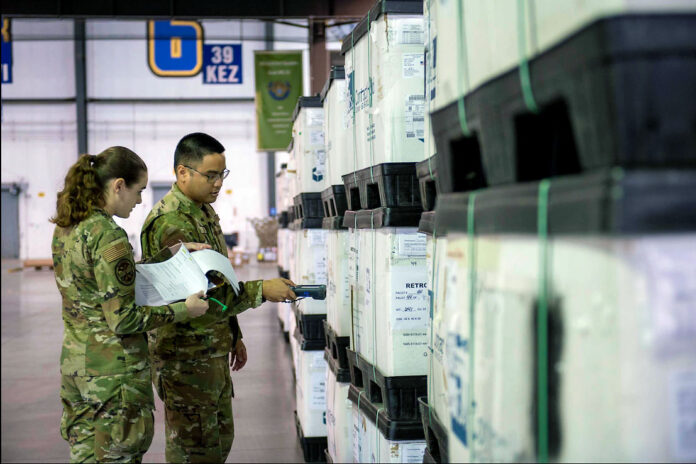 Airmen from the 436th Aerial Port Squadron process shipments of body armor and helmets bound for Ukraine at Dover Air Force Base, Del., March 8th, 2022. (Air Force Tech. Sgt. J.D. Strong II)