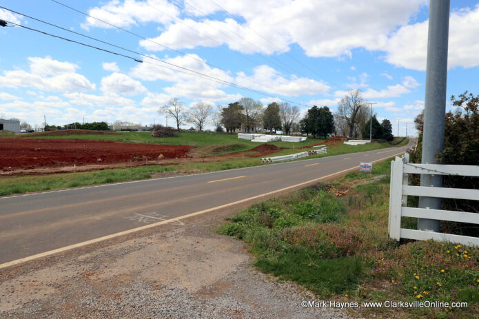 Entrance to the McCraw Strawberry Ranch with an empty field across the street.