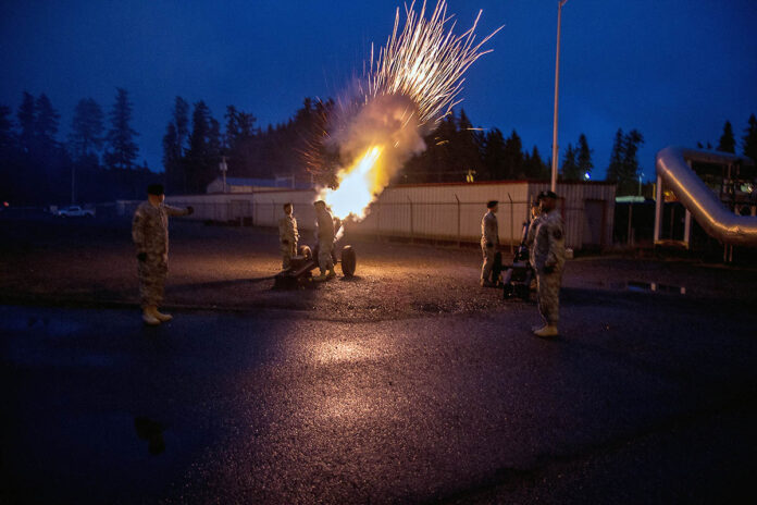 Soldiers fire a howitzer. Feb. 20, 2015, at Joint Base Lewis-McChord, Wash. Howitzers are part of the latest security assistance package bound for Ukraine, worth $800 million. (Army Sgt. Steven Peterson)