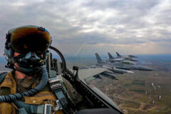 Two U.S. Air Force F-16 Fighting Falcon aircraft assigned to the 480th Expeditionary Fighter Squadron at Spangdahlem Air Base, Germany, fly alongside two Romanian F-16s over nearby Fetesti, Romania, March 14, 2022. (Air Force Senior Airman Ali Stewart)