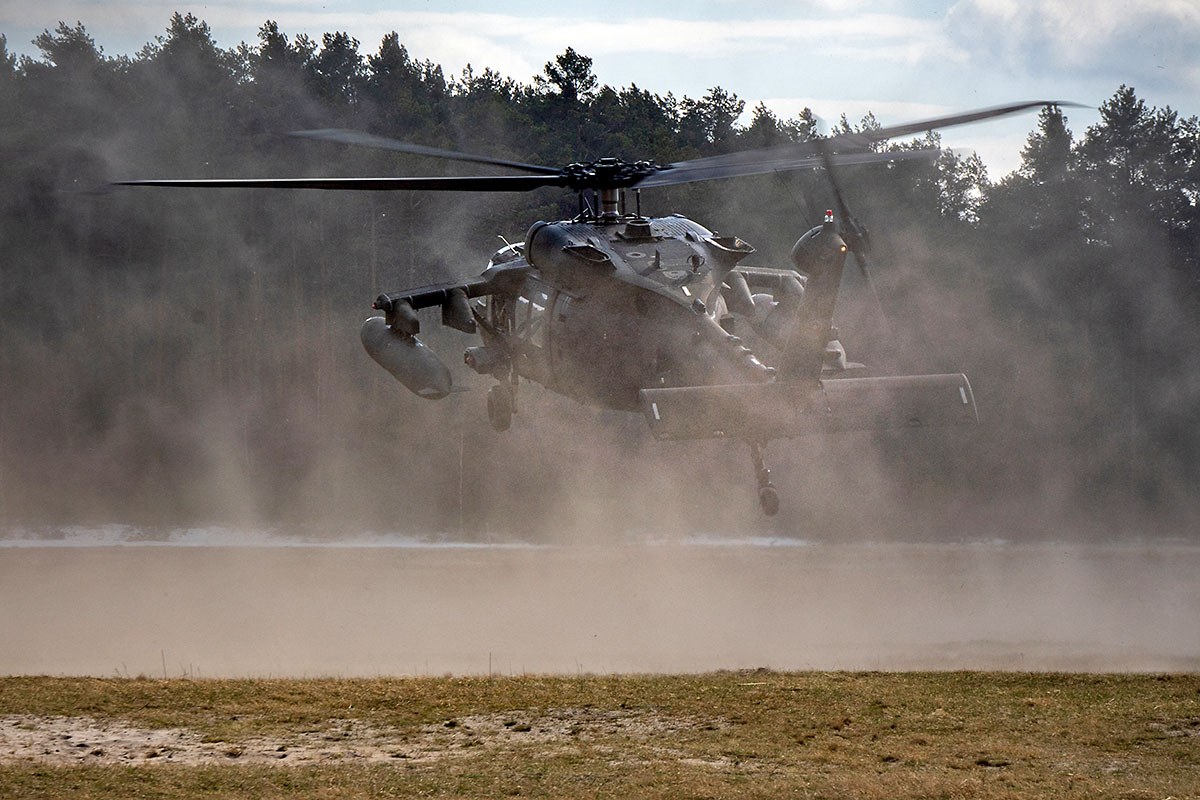 A UH-60 Blackhawk helicopter from the 1-214th General Support Aviation Battalion, 12th Combat Aviation Brigade lands in simulated hostile territory during a personnel recovery exercise at the Nowa Deba Training Area, Poland, April 4, 2022. (Army Staff Sgt. Thomas Mort)