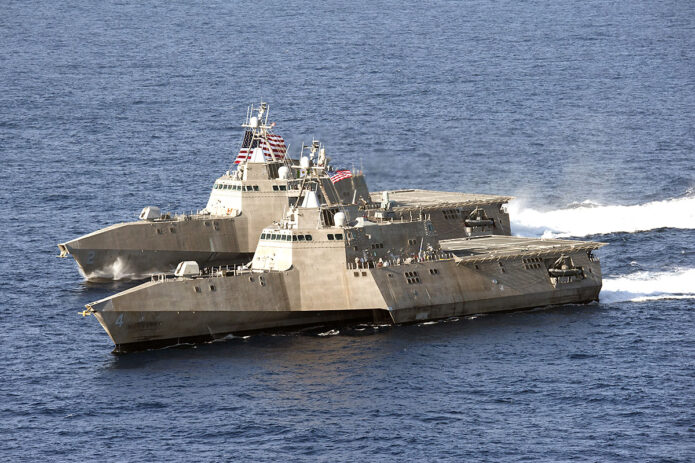 The littoral combat ships USS Independence, back, and USS Coronado underway in the Pacific Ocean in 2014. The Independence was decommissioned last year. (Navy Chief Petty Officer Keith DeVinney)