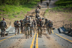 Soldiers with the 3rd Battalion, 187th Infantry Regiment, 3rd Brigade Combat Team, 101st Airborne Division (Air Assault), execute a wet gap crossing with the 502nd Multi-Role Bridge Company, 19th Engineering Battalion on Fort Knox, KY, April 28th, 2022. (Staff Sgt. Michael Eaddy, 3rd Brigade Combat Team, 101st Airborne Division)