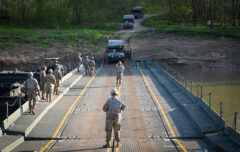 Soldiers with the 3rd Battalion, 187th Infantry Regiment, 3rd Brigade Combat Team, 101st Airborne Division (Air Assault), execute a wet gap crossing with the 502nd Multi-Role Bridge Company, 19th Engineering Battalion on Fort Knox, KY, April 28th, 2022. (Staff Sgt. Michael Eaddy, 3rd Brigade Combat Team, 101st Airborne Division)