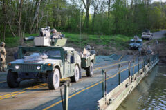 Soldiers with the 3rd Battalion, 187th Infantry Regiment, 3rd Brigade Combat Team, 101st Airborne Division (Air Assault), execute a wet gap crossing with the 502nd Multi-Role Bridge Company, 19th Engineering Battalion on Fort Knox, KY, April 28th, 2022. (Staff Sgt. Michael Eaddy, 3rd Brigade Combat Team, 101st Airborne Division)
