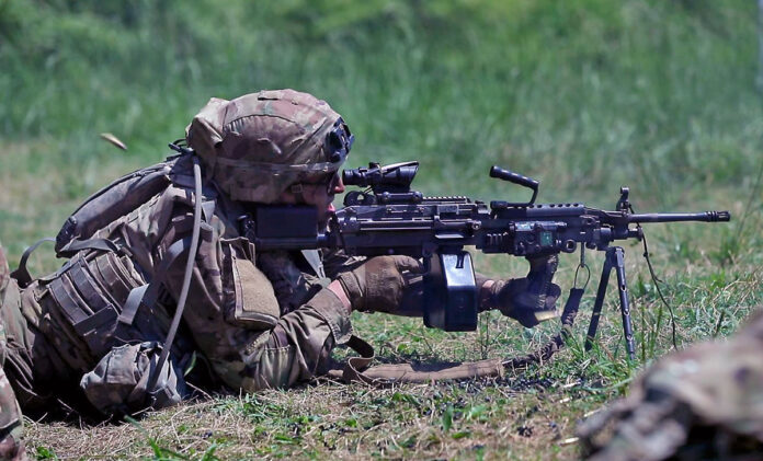 Spc. Hazen Machia of Charlie Troop, 1st Squadron, 32d Cavalry Regiment, 1st Brigade Combat Team, 101st Airborne Division (Air Assault) providing suppressing fire during a Live Fire Gunnery during Operation Lethal Eagle II at Fort Campbell, Ky on Tuesday, May 10th, 2022. (Spc. Jordy Harris, 101st Airborne Division (Air Assault))