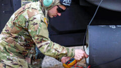 Spc. Jedidiah Marlow, a Mount Orab, Oh. native with 2nd Squadron, 17th Cavalry Regiment, 101st Combat Aviation Brigade, 101st Airborne Division (Air Assault), performs a straight current check on an apache helicopter during a “Fat Cow” mission on May 4th, in Fort Knox, KY. (Sgt. Jeremy Lewis, 40th Public Affairs Detachment)