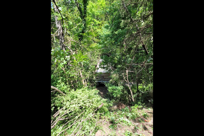 Truck runs off the road and down an embankment at Quarry Road and Providence Bouldevard.