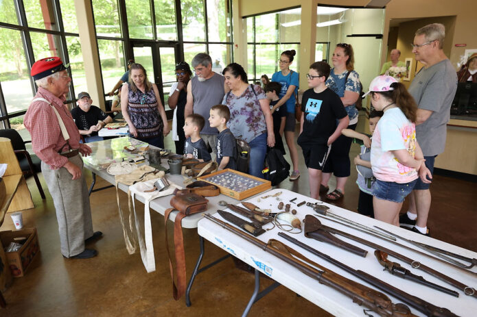 George Wallace telling visitors about some of the equipment a soldier might have carried during the Civil War. (Mark Haynes, Clarksville Online)