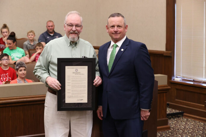 Montgomery County Mayor Jim Durrett presents Roy Manners with retirement proclamation. (Mark Haynes, Clarksville Online)