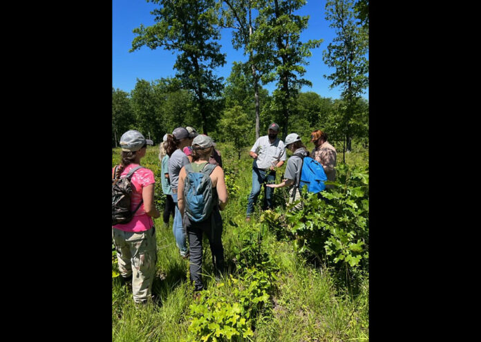 Dr. Dwayne Estes and field trip participants explored the savanna restoration project at Catoosa Wildlife Management.