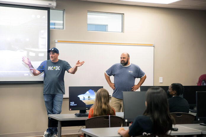 Josh Middleton and Charles Tracy from the Google data center speak at the Austin Peay State University coding camp. (APSU)