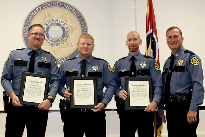 (L to R) Deputy Cody Evans, Deputy Zach Fortner, Deputy Jearmey Vick, Montgomery County Sheriff John Fuson.