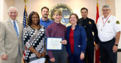 (L to R) Clarksville Mayor Joe Pitts, Deborah Hollingsworth (Leadership for Life teacher), John Linsey (Social Studies teacher), Ethan Steffensmeier, Shelley Steffensmeier, Deputy Chief of Operations Ty Burdine, and School Crossing Guard Jerry Furby.