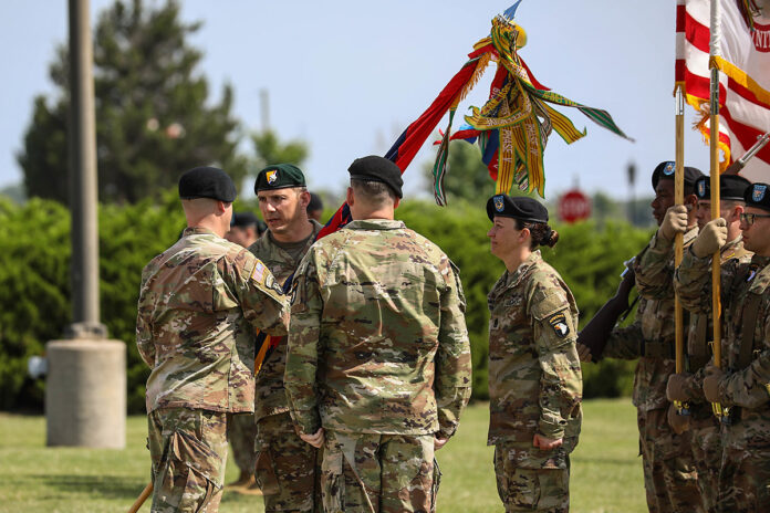 Lt. Col. Benjamin Everrett receives the battalion colors from U.S. Army Col. Patrick Moffett. (Sgt Tanis Kilgore, 40th Public Affairs Detachment)