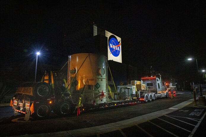 The main body of NASA's Europa Clipper spacecraft is seen in its shipping container as it rolls into the agency's Jet Propulsion Laboratory in Southern California. (NASA/JPL-Caltech/Johns Hopkins APL/Ed Whitman)