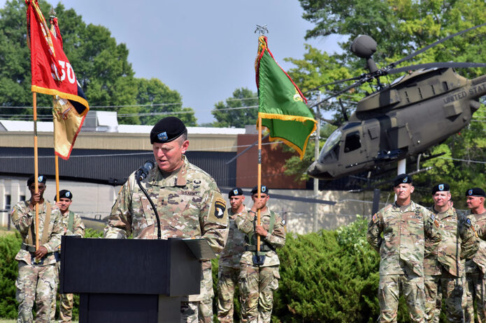 U.S Army Maj. Gen. JP McGee, commanding general, 101st Airborne Division (Air Assault), gives a speech during the division’s color casing ceremony at McAuliffe Hall, Fort Campbell, Ky., July 5, 2022. The ceremony was held to officially mark the Screaming Eagle’s deployment to the European Command theater of operations to assure NATO allies and deter Russian aggression in the region. The casing of the colors symbolizes their departure from Fort Campbell, Ky. Their colors will remain cased until they redeploy the European Command theater of operations. (Sgt. 1st Class Sinthia Rosario, 101st Airborne Division Public Affairs)