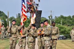 U.S Army Maj. Gen. JP McGee, right, commanding general, 101st Airborne Division (Air Assault), and Command Sgt. Maj. Veronica Knapp, left, case the division colors during a color casing ceremony at  McAuliffe Hall, Fort Campbell, Ky., July 5, 2022. The ceremony was held to officially mark the Screaming Eagle’s deployment to the European Command theater of operations to assure NATO allies and deter Russian aggression in the region. (Sgt. 1st Class Sinthia Rosario, 101st Airborne Division Public Affairs)