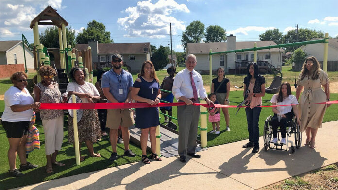 Jennifer Letourneau, Clarksville Mayor Joe Pitts, and Councilperson Ambar Marquis open the new playground at Sherwood Forest Park.