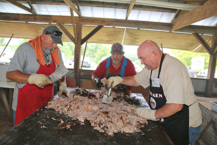 Central Civitan Club members preparing BBQ for the Lone Oak Picnic. (Clarksville Online)