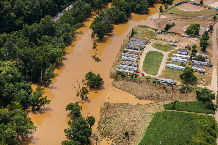 A Kentucky Army National Guard flight crew from Bravo Co., 2/147th Assault Helicopter Battalion provided a media flight for local news networks around eastern Kentucky on July 30, 2022. Their mission was to assist media in capturing aerial footage of the flood effected regions. (U.S Army photo by Spc. Danielle Sturgill)