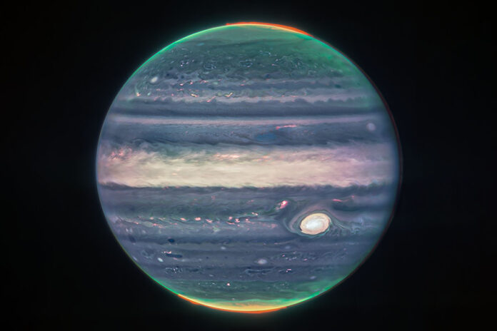 Auroras and hazes glow in this composite image of Jupiter taken by NASA's James Webb Space Telescope's Near-Infrared Camera. (NASA, ESA, CSA, Jupiter ERS Team; image processing by Judy Schmidt)