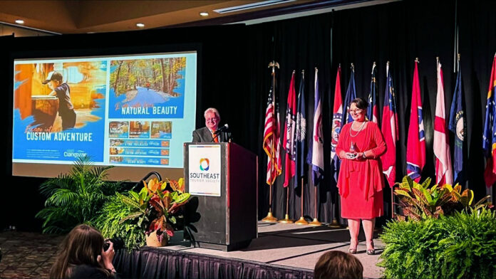 Michelle Dickerson, Visit Clarksville’s Media and Marketing Director, proudly displays the Best Marketing Shining Example Award.