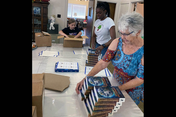 Women in Action Preparing the Dictionaries for delivery