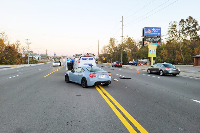 Wreck with injuries on Fort Campbell Boulevard involving two vehicles and a bicyclist.