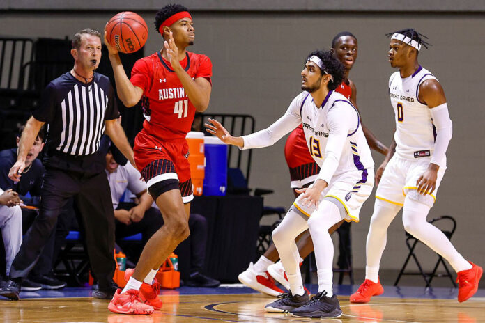 Austin Peay State University Men's Basketball's Cameron Copeland looks to pass the ball while being guarded by Albany's Sarju Patel on Monday. (David Rosenblum)