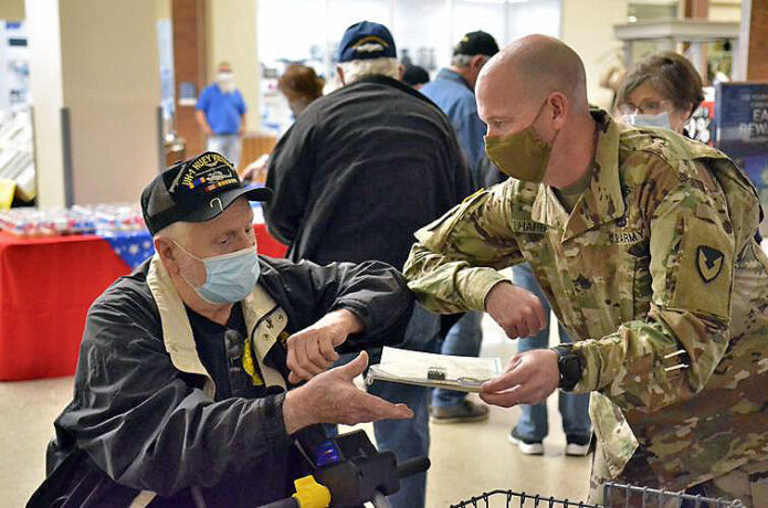 Harold O’Daniel, Vietnam War veteran, receives a pin from Command Sgt. Maj. Joseph G. Harbour, garrison senior enlisted adviser, March 29th, 2021 during a ceremony at the Fort Campbell Exchange. (Fort Campbell Courier Archive)