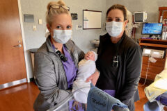 Certified Nurse Midwives, Lt. Col. Laurey Tyson (right) and Jessica Chance hold a newborn in a labor and delivery suite at Blanchfield Army Community Hospital, Fort Campbell, Kentucky, Aug. 22. More than 1,400 babies were born at Blanchfield over the past year. The hospital features seven labor suites and two labor and delivery operating rooms. (Maria Yager, Department of Defense)