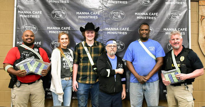 Clarksville Police Department drops off reflective belts, straps, and keychain tags at Manna Cafe Ministries.